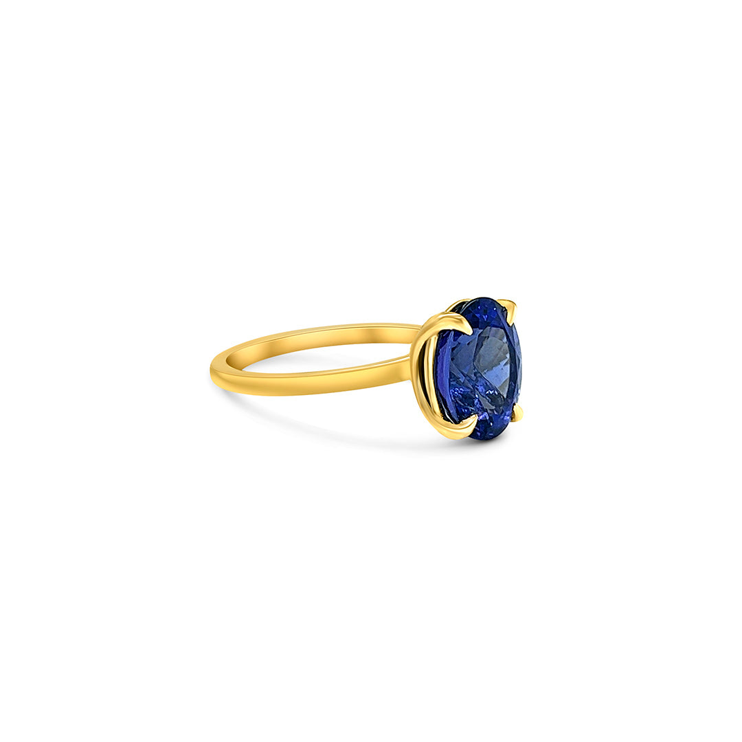 Oval solitaire tanzanite ring 4.10ct tanzanite diamond ring Tanzanite and diamond claw ring Gemstone solitaire jewelry Tanzanite engagement ring Fine jewelry craftsmanship Violet gemstone ring Exquisite diamond accents Luxury gemstone ring Statement solitaire ring Elegance and sophistication Handcrafted claw setting
