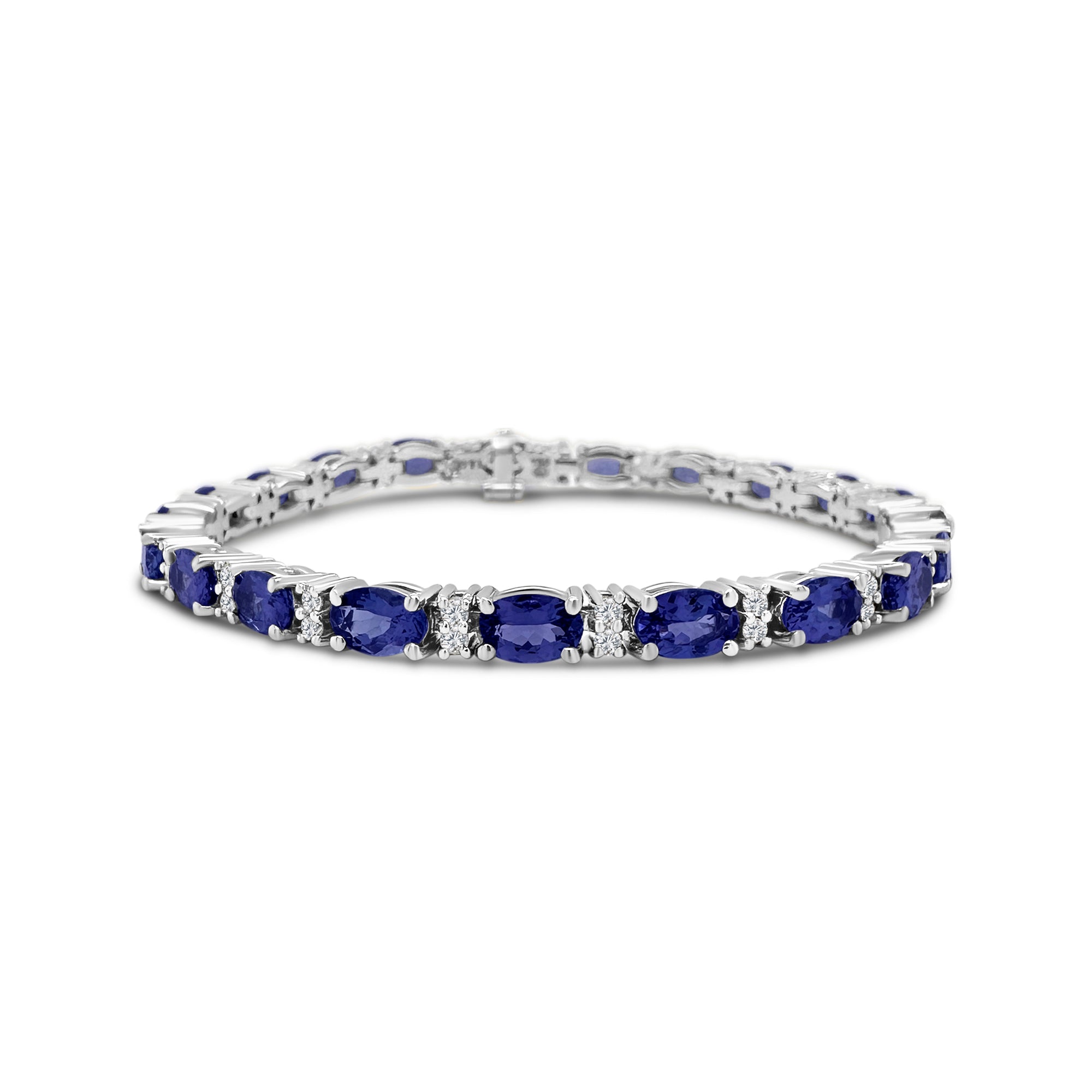 "Oval Tanzanite Bracelet, Tanzanite and Diamond Jewelry, Gemstone Diamond Bracelet, Fine Jewelry Bracelet, Elegant Gemstone Bracelet, Tanzanite and Diamond Accent Bracelet, Oval Tanzanite and Diamond Wristwear, Luxury Gemstone Jewelry, Oval Tanzanite with Diamond Accents, Stylish Gemstone Bracelet"