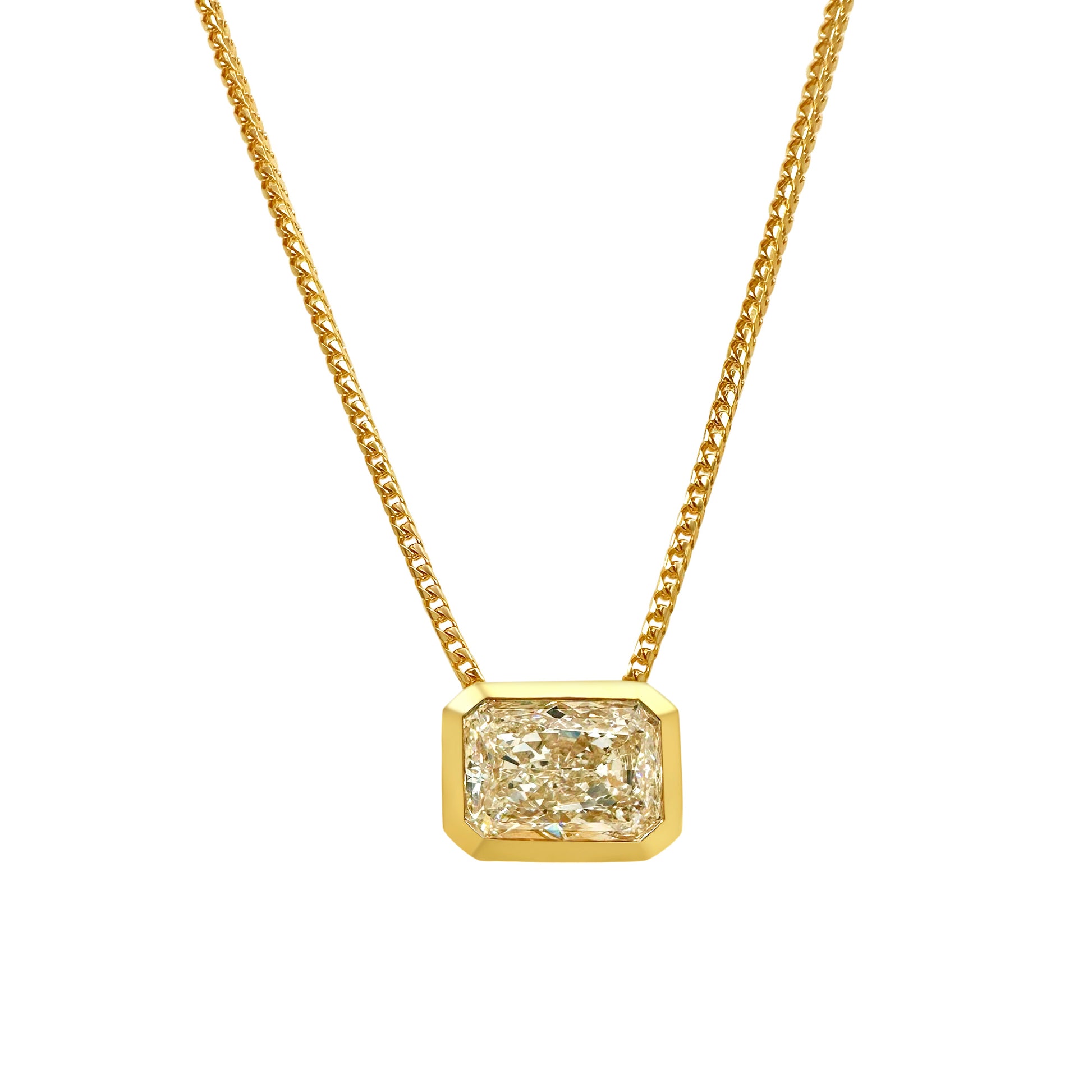Radiant cut diamond pendant, sparkling jewelry, luxurious necklace, elegant accessory, stunning gemstone pendant, exquisite diamond jewelry, statement piece, fine craftsmanship, dazzling pendant necklace.