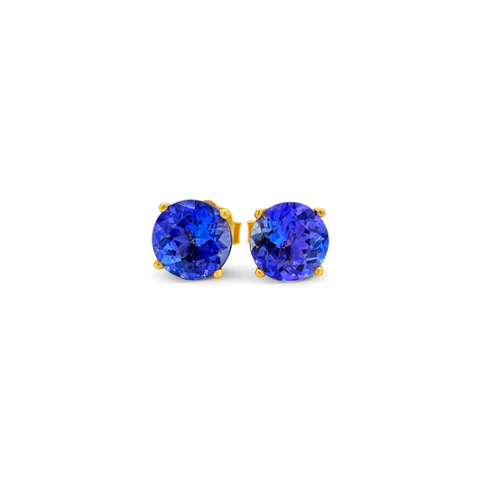 Round Tanzanite stud earrings, sparkling Tanzanite studs, elegant Tanzanite ear studs, precious Tanzanite gems, classic round Tanzanite earrings, beautiful blue Tanzanite studs, stunning Tanzanite jewelry, dainty Tanzanite studs, exquisite round Tanzanite earrings, vibrant Tanzanite studs.