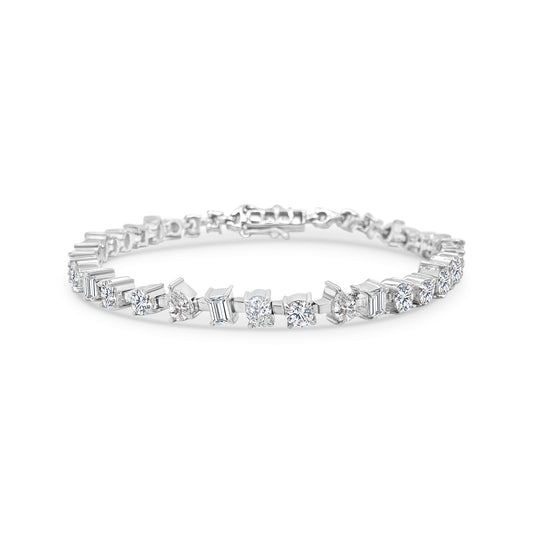 "Multi-Shaped Diamond Tennis Bracelet," "Diamond Tennis Bracelet," "Fine Jewelry," "Luxury Bracelet," "Fashion Bracelet," "Diamond Jewelry," "Sparkling Tennis Bracelet," "Statement Bracelet," "Elegant Jewelry," "Special Occasion Bracelet," "Multi-Cut Diamond Bracelet," "Timeless Jewelry," "Handcrafted Diamond Bracelet," "Versatile Diamond Bracelet," "Designer Tennis Bracelet."