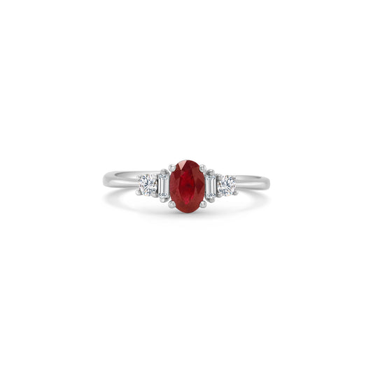 An elegant, oval ruby ring, adorned with sparkling diamonds, perfect for special occasions, adding sophistication and glamour to any ensemble.