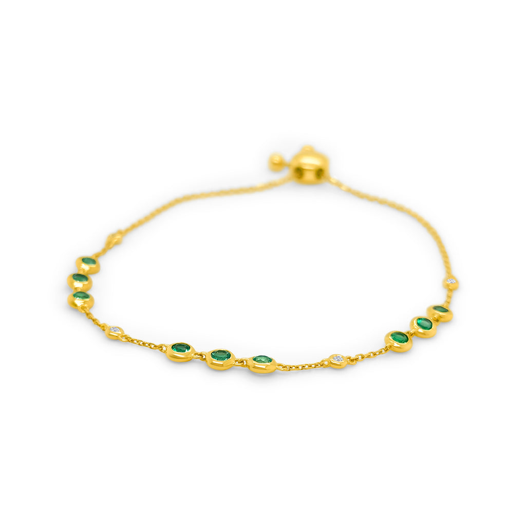 A luxurious, round emerald and diamond bracelet, showcasing exquisite craftsmanship, elegant emeralds glistening alongside brilliant diamonds, a timeless accessory capturing sophistication and grace.