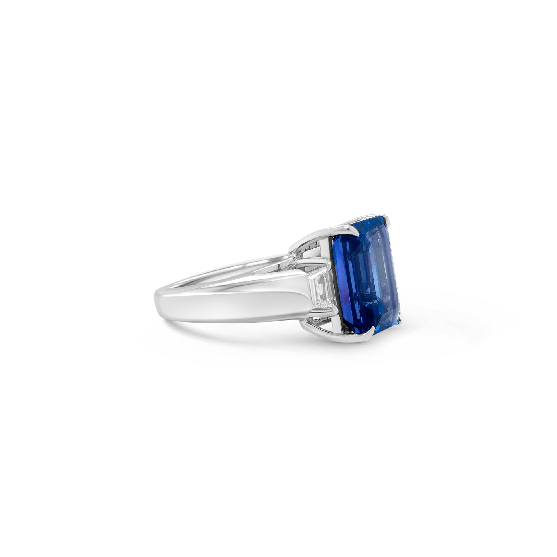 Emerald cut tanzanite ring, Trilogy ring, Diamond accent ring, Elegant gemstone jewelry, Statement piece, Luxury fashion accessory.