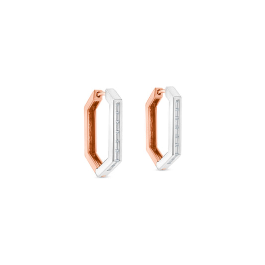 Elegant baguette cut diamond huggy earrings in white gold, Close-up of sparkling baguette cut diamond hoop earrings, Luxury diamond huggy earrings with baguette cut stones, Pair of baguette cut diamond huggies for women, Baguette diamond huggy earrings with secure clasp, Fine jewelry baguette diamond huggies in gold