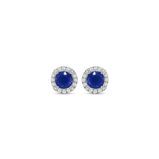 Round Tanzanite & Diamond Halo Stud Earrings" Tanzanite Detail: "Vibrant Round Tanzanite Gemstone" Diamond Halo: "Halo of Diamonds Surrounding Tanzanite" Earring Set: "Elegant Set of Tanzanite & Diamond Stud Earrings" Liner Options: "Earrings with Different Open Liners for Customization" Radiant Beauty: "Sparkling Tanzanite & Diamond Halo Stud Earrings"