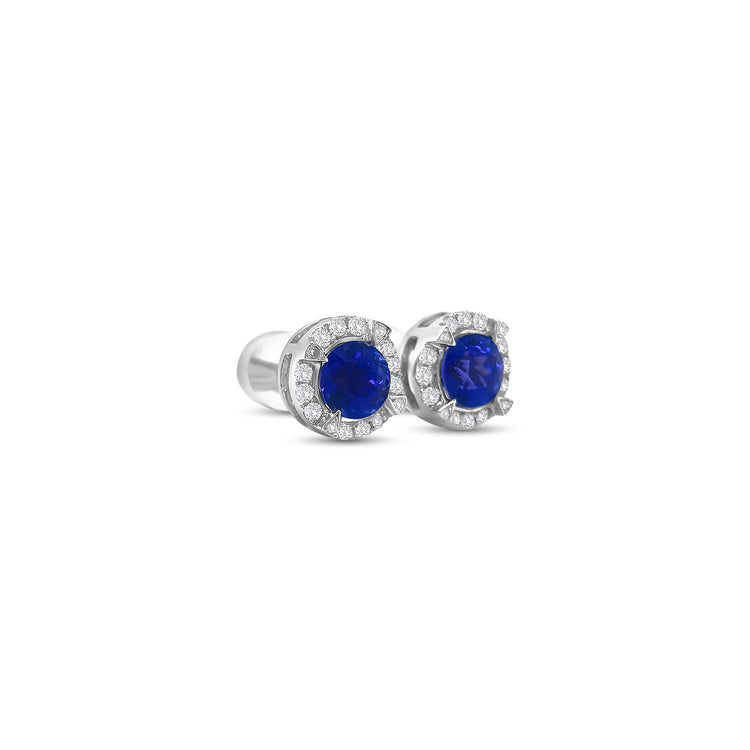 Round Tanzanite & Diamond Halo Stud Earrings" Tanzanite Detail: "Vibrant Round Tanzanite Gemstone" Diamond Halo: "Halo of Diamonds Surrounding Tanzanite" Earring Set: "Elegant Set of Tanzanite & Diamond Stud Earrings" Liner Options: "Earrings with Different Open Liners for Customization" Radiant Beauty: "Sparkling Tanzanite & Diamond Halo Stud Earrings"
