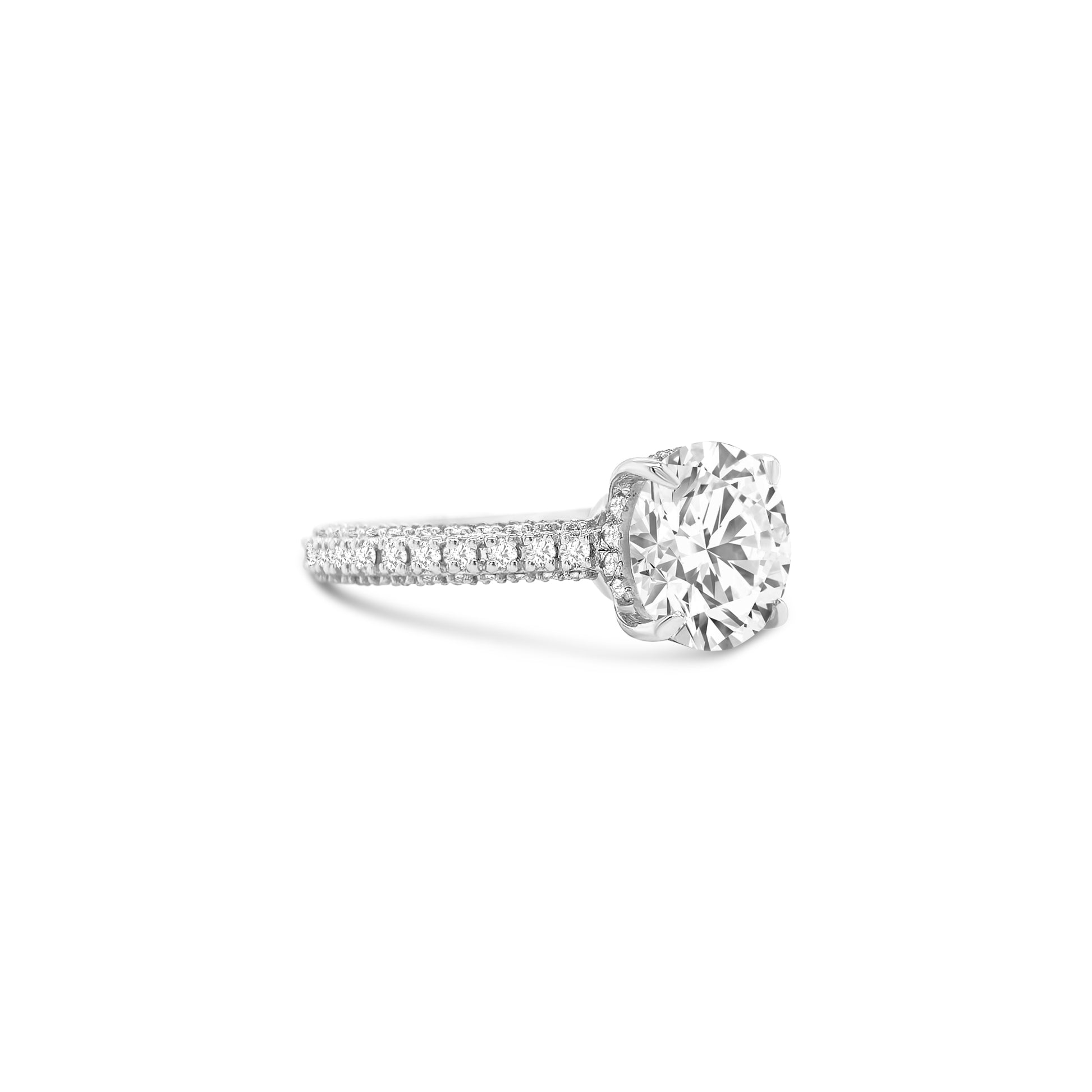 This elegant round solitaire diamond ring features sparkling side stones, perfect for engagements or special occasions.