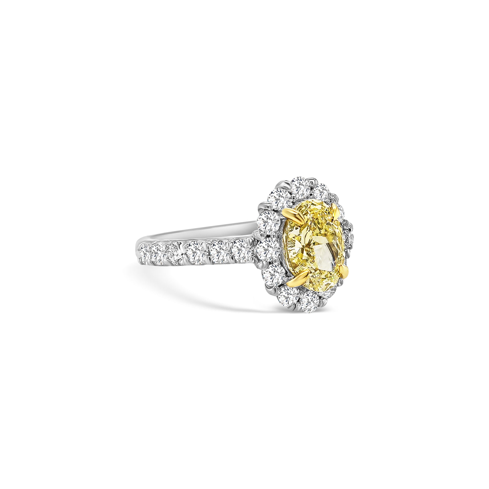 Discover timeless elegance with this Fancy Yellow Oval and Floral Diamond Halo Ring. A stunning blend of luxury and craftsmanship, perfect for any special occasion