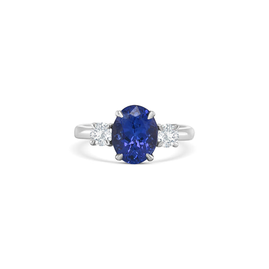tanzanite trilogy ring, oval tanzanite diamond ring, three-stone tanzanite engagement ring, tanzanite and round diamond ring, elegant tanzanite ring