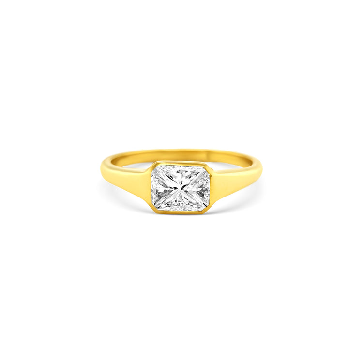 radiant cut diamond ring, radiant solitaire ring, radiant diamond engagement ring, yellow gold radiant diamond ring, elegant diamond jewelry, radiant cut fine jewelry, women’s radiant cut diamond ring, luxury diamond solitaire, modern radiant cut ring, radiant cut bridal jewelry