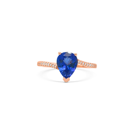 pear shape tanzanite ring, pear cut gemstone ring, tanzanite and diamond ring, elegant pear cut tanzanite jewelry, luxury gemstone ring, women’s tanzanite diamond ring, pear shaped engagement style ring, fine gemstone jewelry, white gold tanzanite and diamond ring, sparkling pear cut tanzanite ring