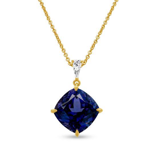 A cushion cut tanzanite pendant, sparkling with diamonds, radiant gemstone jewelry, luxurious tanzanite necklace, dazzling diamond and tanzanite pendant, elegant gemstone pendant, exquisite cushion cut tanzanite and diamond necklace.