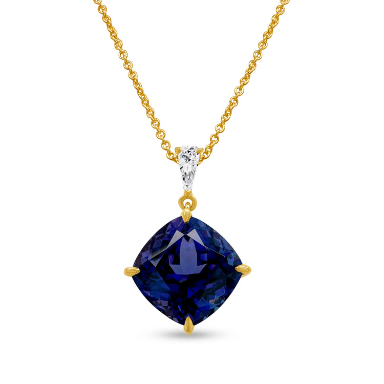 A cushion cut tanzanite pendant, sparkling with diamonds, radiant gemstone jewelry, luxurious tanzanite necklace, dazzling diamond and tanzanite pendant, elegant gemstone pendant, exquisite cushion cut tanzanite and diamond necklace.