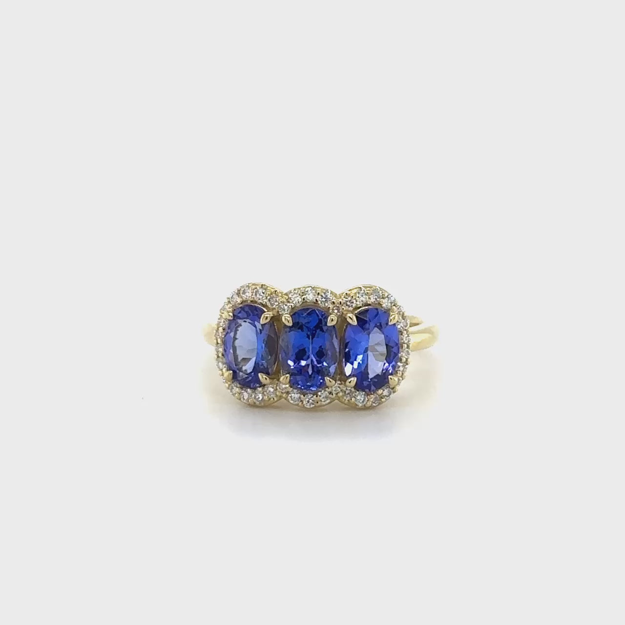 "Oval Cut Tanzanite Diamond Halo Ring," "Tanzanite Halo Ring," "Diamond Halo Ring," "Fine Jewelry," "Luxury Ring," "Fashion Ring," "Tanzanite Jewelry," "Sparkling Halo Ring," "Statement Ring," "Elegant Jewelry," "Special Occasion Ring," "Tanzanite and Diamond Ring," "Timeless Jewelry," "Handcrafted Tanzanite Ring," "Gemstone Halo Ring."