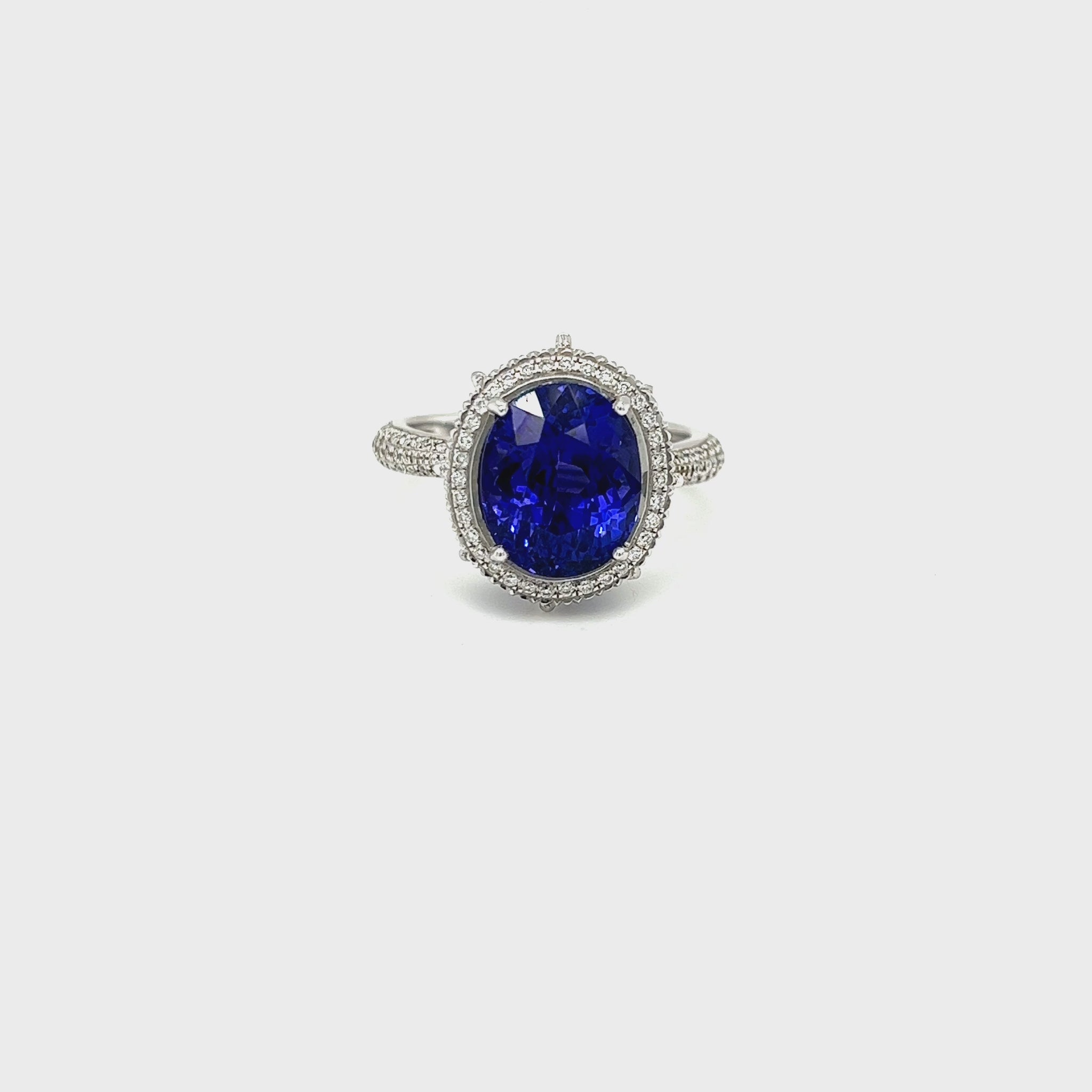Oval Tanzanite and Halo Diamond Ring - 4.90ct Tanzanite Center Stone Exquisite Gemstone Jewelry - Oval Tanzanite with Diamond Halo Sophisticated Tanzanite and Diamond Ring - Blue-violet Oval Gemstone Halo Diamond Ring - 4.90ct Oval Tanzanite Centerpiece Elegant Tanzanite and Diamond Ring - Dazzling Gemstone Jewelry Glamorous Oval Tanzanite Ring - Sparkling Diamond Accents Special Occasion Accessory - 4.90ct Oval Tanzanite and Diamond Halo Unique Gemstone Jewelry - Brilliant Blue-violet Tanzanite Ring