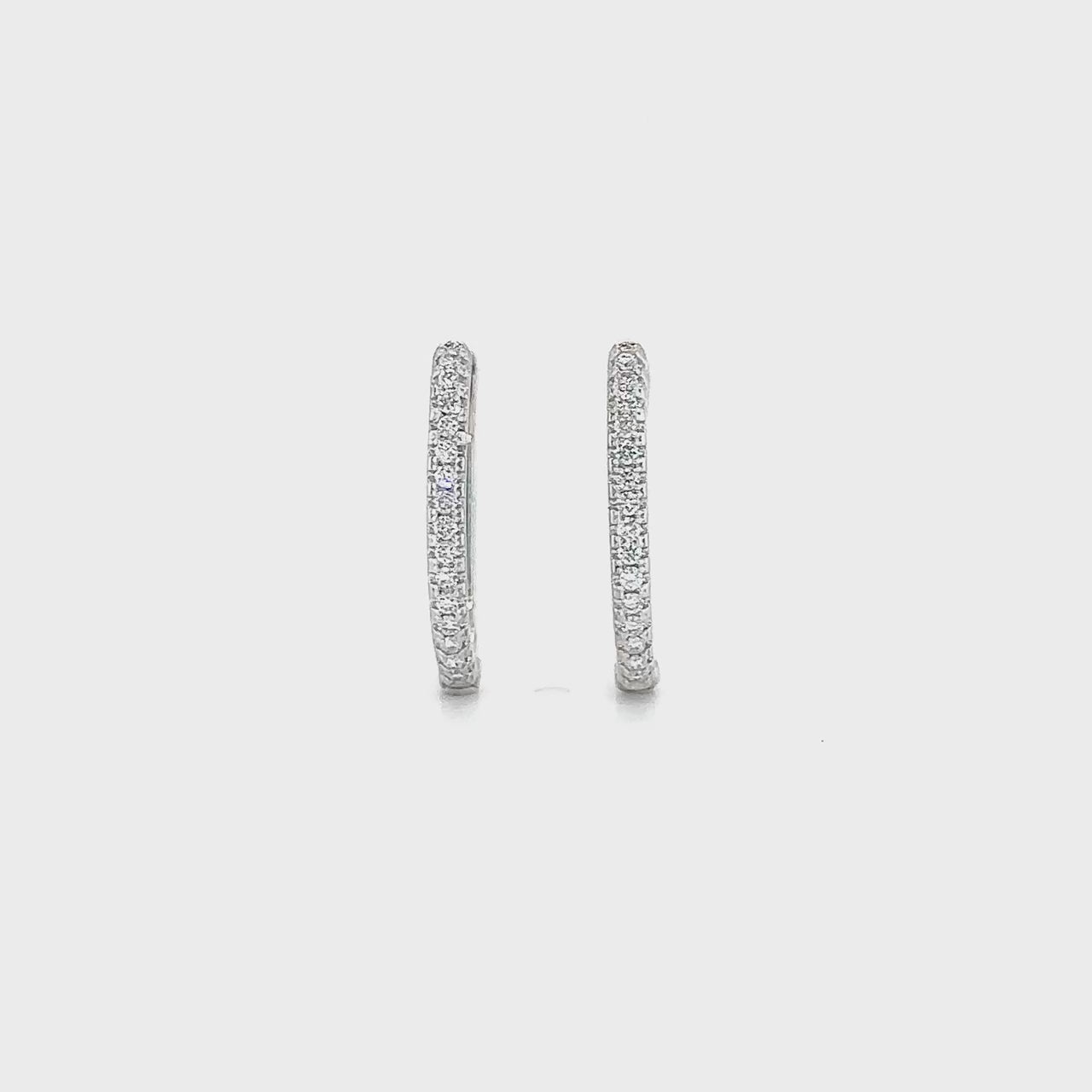"Round Brilliant Diamond Huggy Earrings," "Exquisite Round Brilliant Diamond Earrings," "Luxurious Diamond Huggy Earrings," "Elegant Round Diamond Huggy Earrings," "Fine Jewelry with Round Brilliant Diamonds," "High-Quality Diamond Huggy Earrings," "Statement Round Brilliant Diamond Earrings," "Sparkling Diamond Huggy Earrings," "Beautiful Round Brilliant Diamond Earrings," "Fashionable Diamond Huggy Earrings."