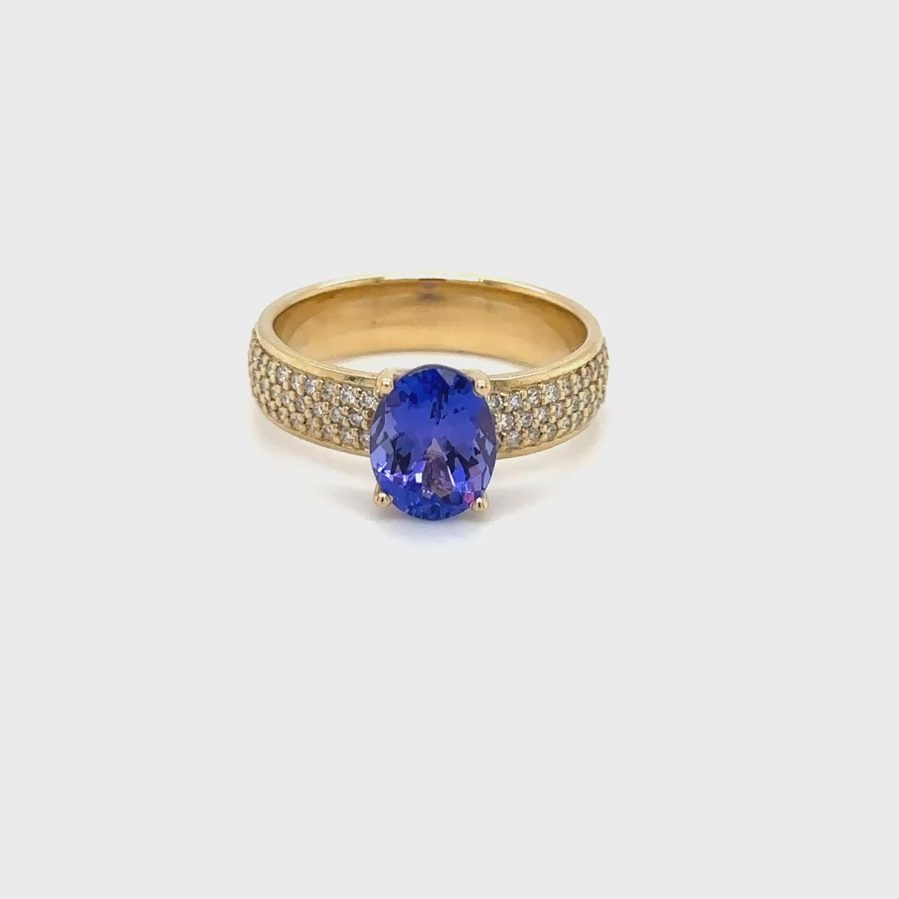 "Oval Shaped Tanzanite & Diamond Ring," "Exquisite Oval Tanzanite Diamond Ring," "Luxurious Oval Tanzanite and Diamond Jewelry," "Elegant Oval Shaped Tanzanite Ring," "Fine Jewelry with Oval Tanzanite and Diamonds," "High-Quality Tanzanite and Diamond Ring," "Statement Oval Tanzanite Diamond Ring," "Sparkling Oval Shaped Tanzanite Jewelry," "Beautiful Diamond and Tanzanite Ring," "Fashionable Oval Tanzanite & Diamond Ring."