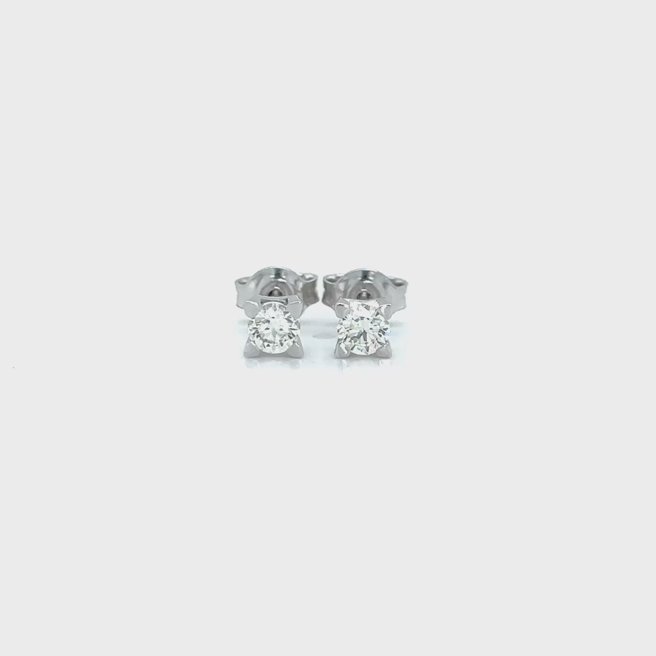"Round diamond stud earrings," "Brilliant cut diamond earrings," "Classic diamond studs," "Sparkling round studs," "Timeless diamond earrings," "Elegant diamond studs," "Round brilliant earrings," "Diamond solitaire studs," "Dazzling diamond studs," "Simple yet stunning diamond earrings."