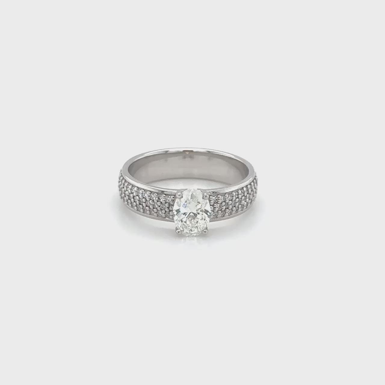 Oval diamond band, round brilliant diamond band, elegant diamond ring, sparkling gemstone band, fine jewelry accessory, diamond-studded band, stylish oval and round diamonds, luxurious diamond ring, exquisite gemstone band.