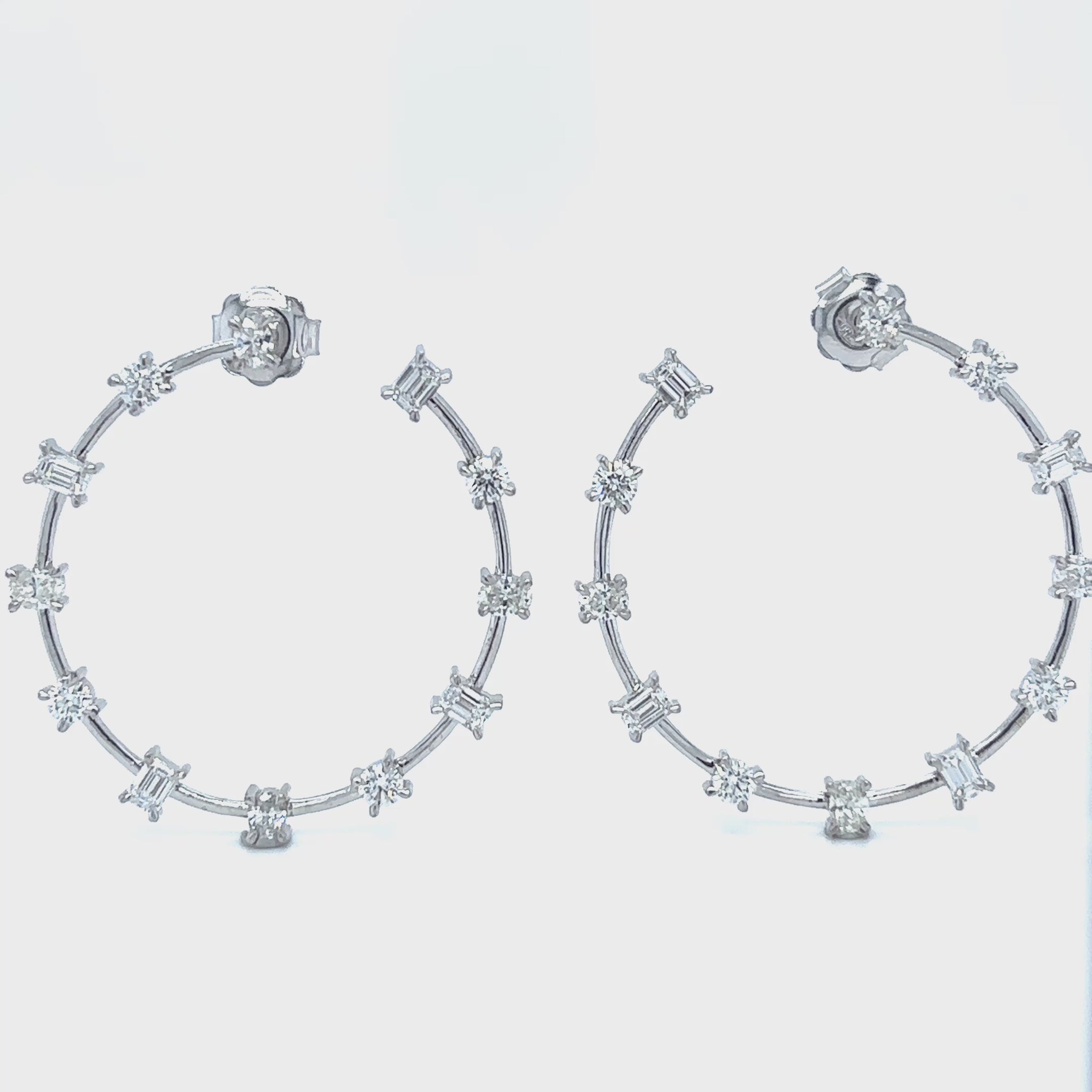 "Round Brilliant Oval & Emerald Cut Diamond Hoop Earrings," "Luxury Diamond Hoop Earrings with Round Oval and Emerald Cuts," "Elegant Multi Shape Diamond Hoop Earrings," "Round Brilliant Diamond Hoop Earrings," "Oval Cut Diamond Hoop Earrings," "Emerald Cut Diamond Hoop Earrings," "Exquisite Multi Cut Diamond Hoop Earrings," "Fine Jewelry Diamond Hoop Earrings Multi Shapes," "Unique Round Oval Emerald Cut Diamond Hoop Earrings," "Sparkling Diamond Hoop Earrings with Round Brilliant Oval and Emerald Cuts."