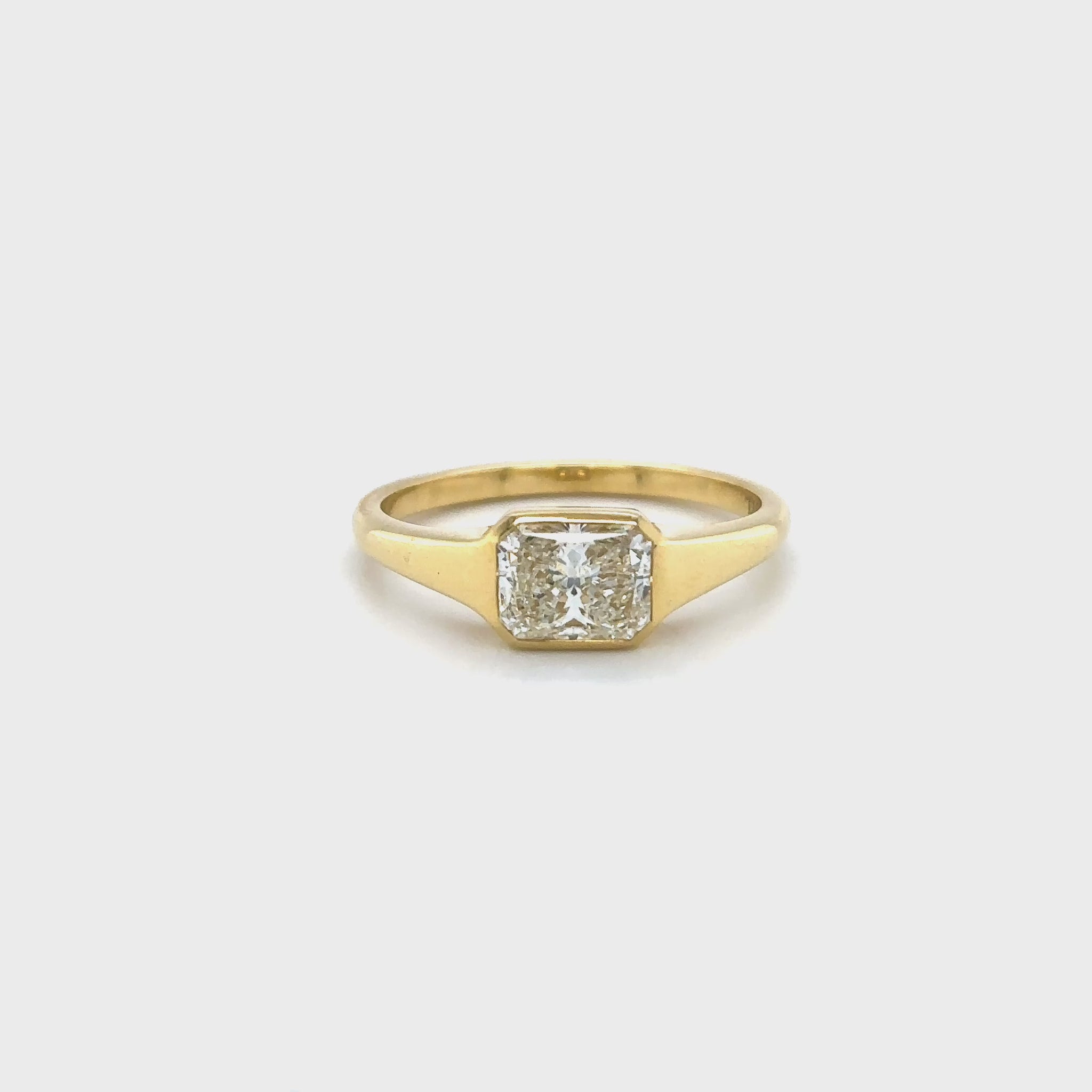 radiant cut diamond ring, radiant solitaire ring, radiant diamond engagement ring, yellow gold radiant diamond ring, elegant diamond jewelry, radiant cut fine jewelry, women’s radiant cut diamond ring, luxury diamond solitaire, modern radiant cut ring, radiant cut bridal jewelry