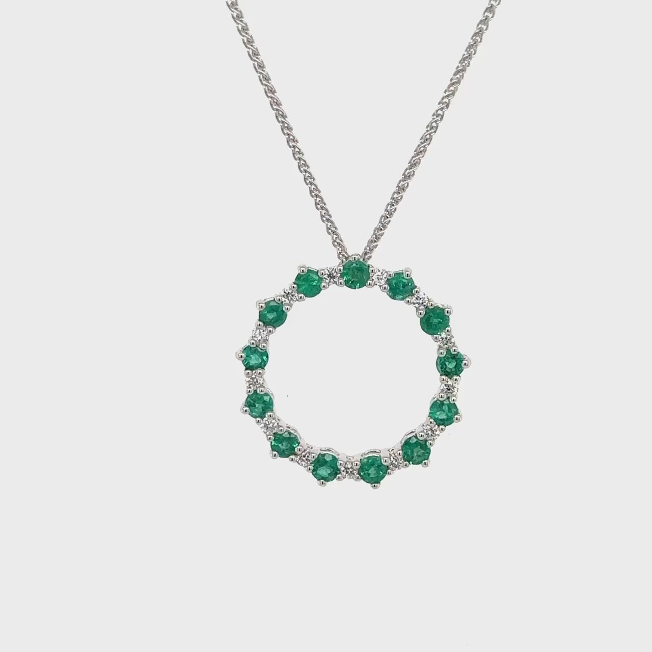 Circle Pendant with Emerald and Diamonds, Gold Circle Pendant with Emerald and Diamond, Elegant Emerald and Diamond Necklace, Fine Jewelry Emerald & Diamond Circle Pendant, Birthstone Circle of Life Pendant, Emerald Pendant with Diamonds, Circle Pendant in Gold with Emerald and Diamond, Emerald and Diamond Jewelry Circle.