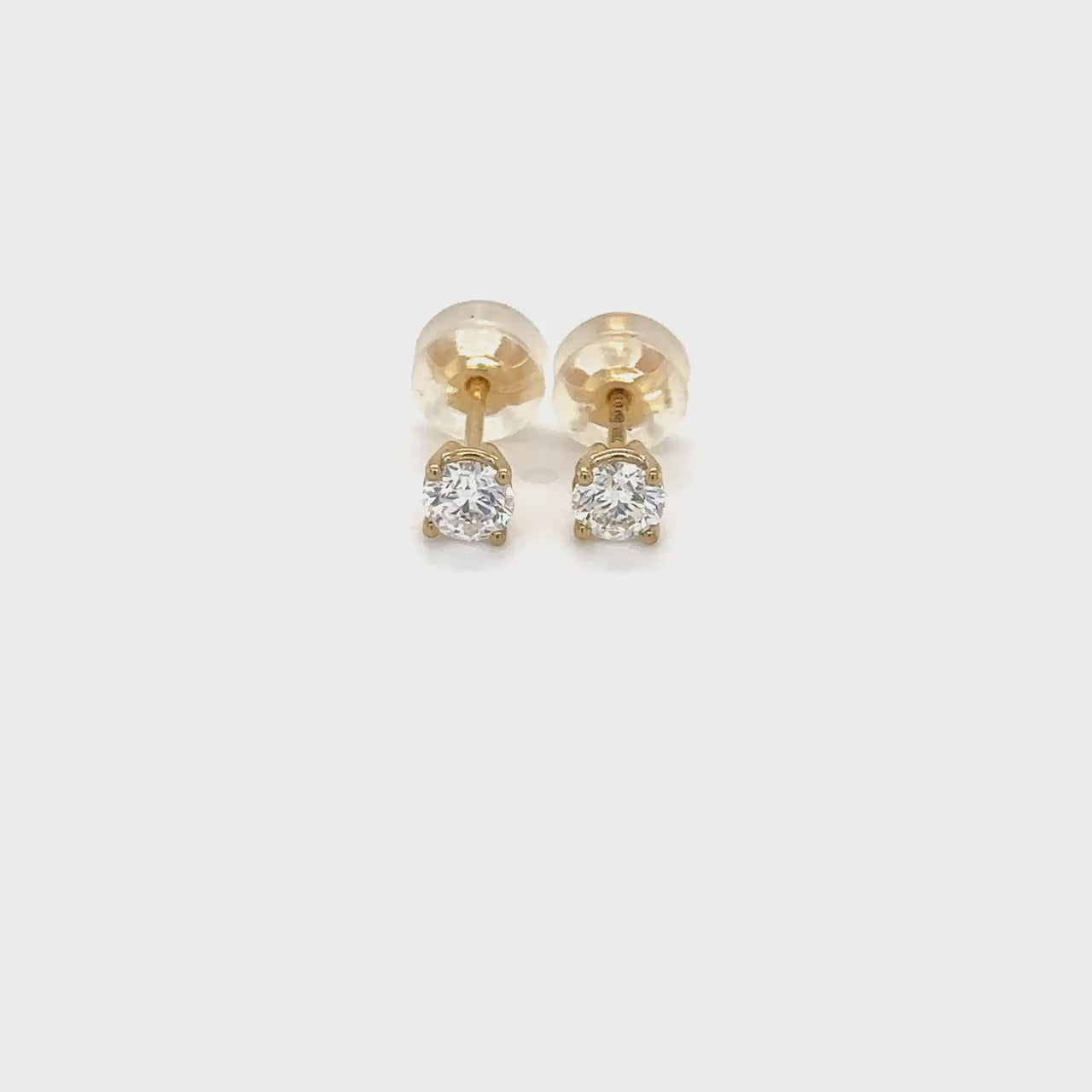 "Round Brilliant Diamond Stud Earrings," "Exquisite Round Brilliant Diamond Earrings," "Luxurious Diamond Stud Earrings," "Elegant Round Diamond Studs," "Fine Jewelry with Round Brilliant Diamonds," "High-Quality Round Brilliant Diamond Earrings," "Statement Round Diamond Stud Earrings," "Sparkling Round Brilliant Diamond Studs," "Beautiful Round Diamond Earrings," "Classic Diamond Stud Earrings."