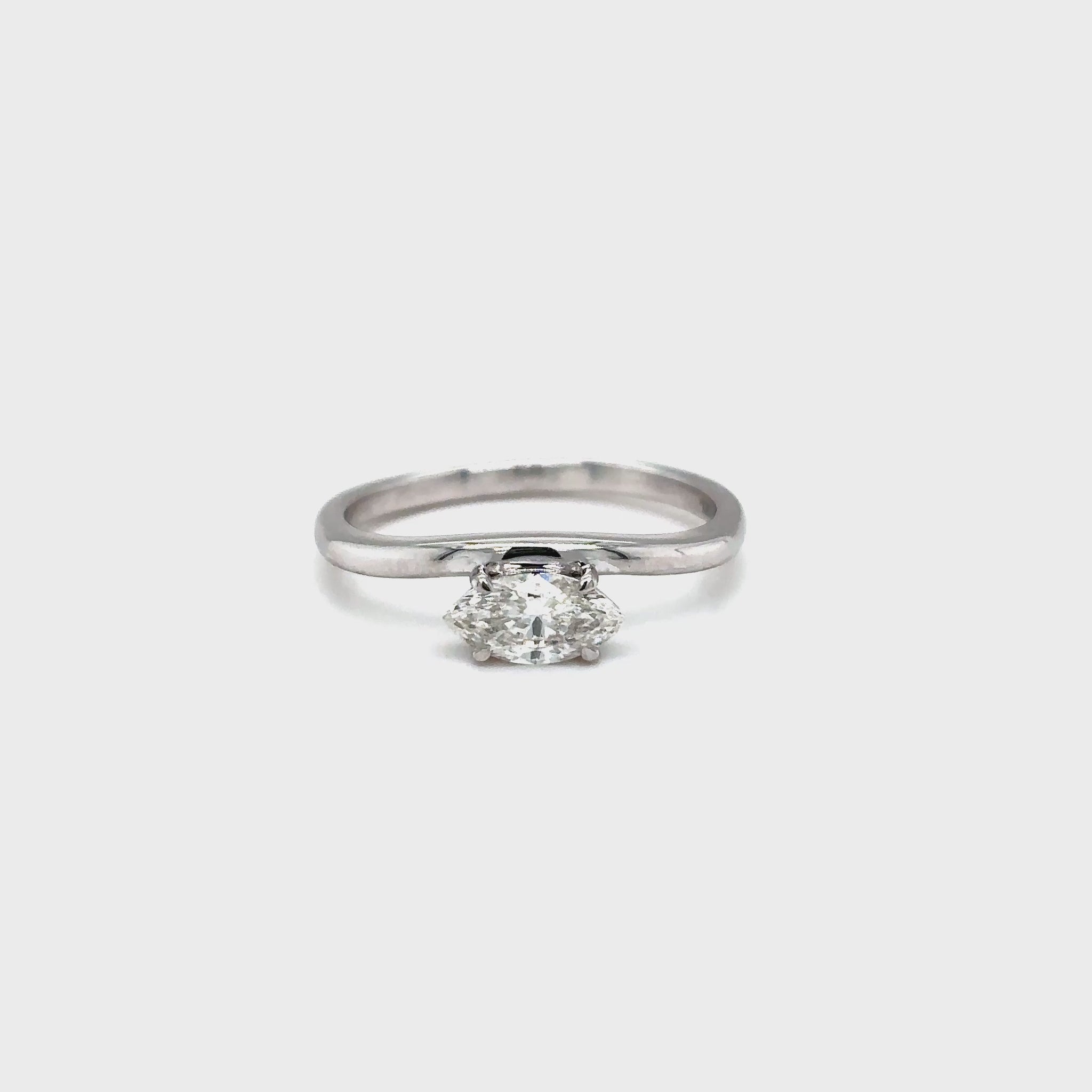marquise cut diamond ring, solitaire diamond ring, white gold engagement ring, marquise diamond solitaire, white gold solitaire ring, minimalist diamond ring, elegant marquise ring, marquise diamond ring white gold, classic engagement ring, marquise cut white gold ring