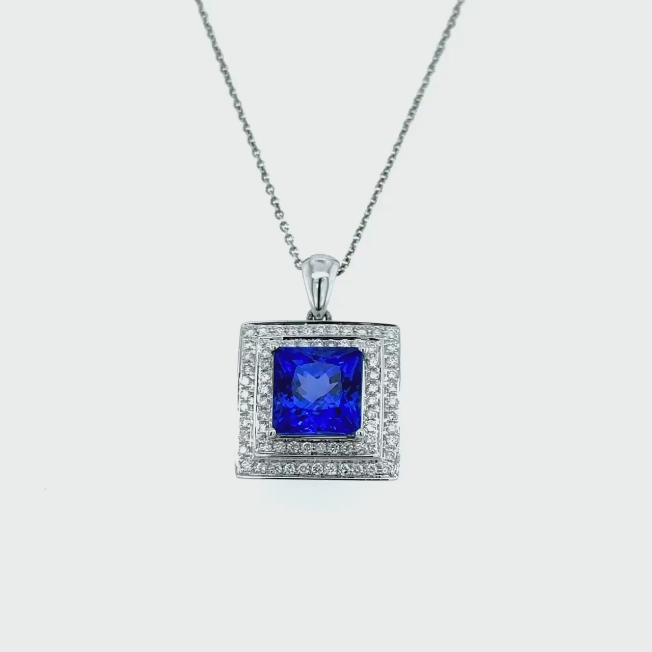  Cushion cut tanzanite and diamond pendant, luxurious tanzanite pendant, elegant diamond pendant, cushion cut gemstone necklace, diamond accent necklace, fine jewelry pendant, statement necklace, gemstone pendant, sophisticated accessory.