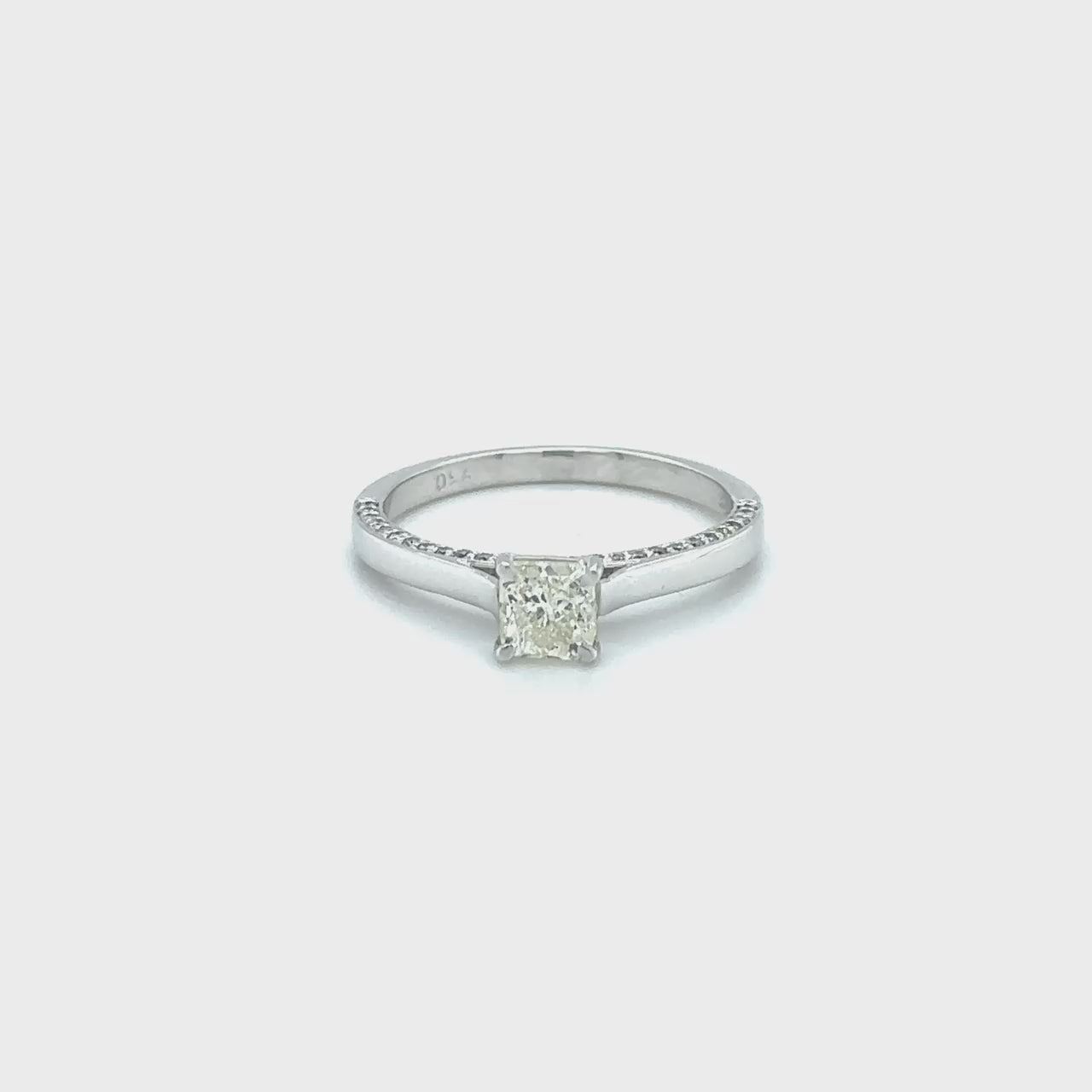 "A stunning cushion-cut diamond ring," "a luxurious solitaire engagement ring," "a sparkling diamond ring for special occasions," "an elegant cushion-cut solitaire ring," "a timeless diamond ring design," "a classic cushion-cut diamond engagement ring."
