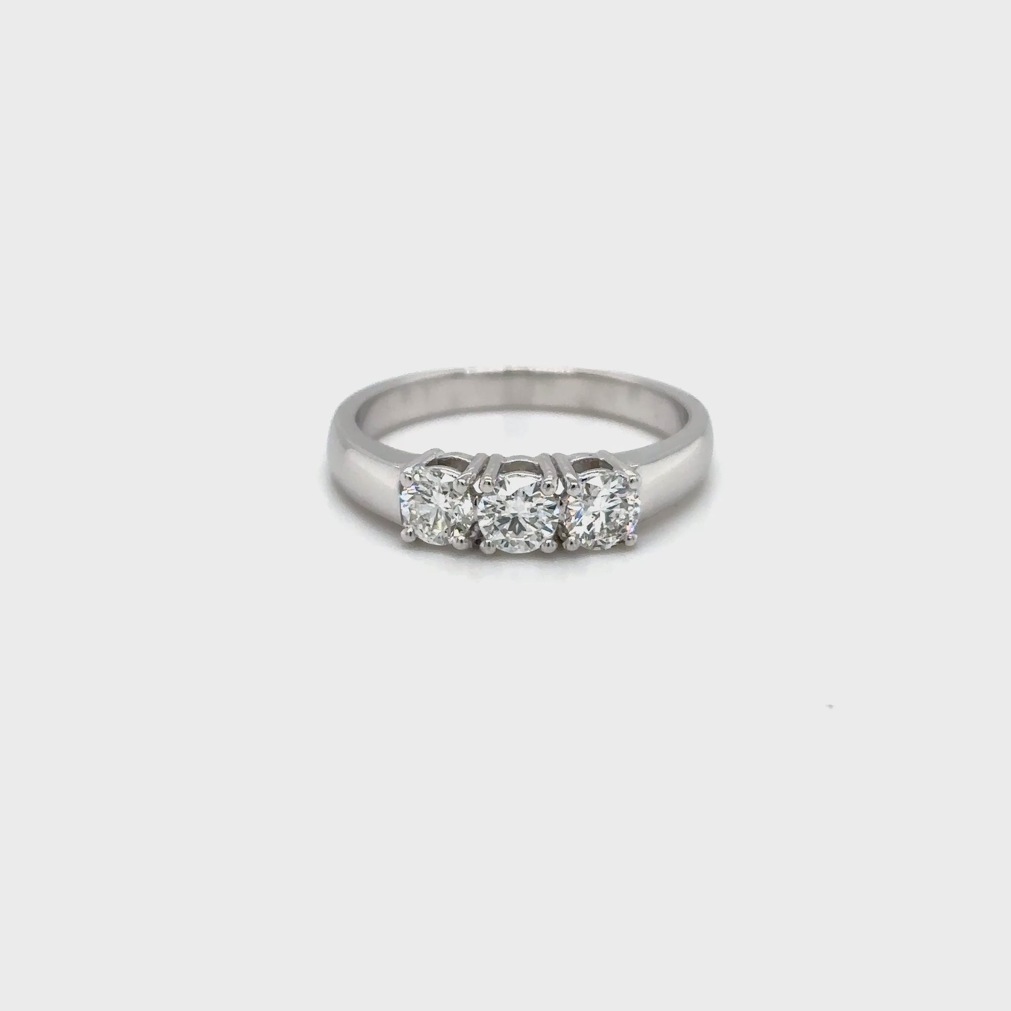 round brilliant diamond ring, trilogy diamond ring, white gold diamond ring, three stone diamond ring, white gold trilogy ring, round cut diamond ring, engagement trilogy ring, white gold engagement ring, classic diamond trilogy ring, bridal trilogy ring white gold