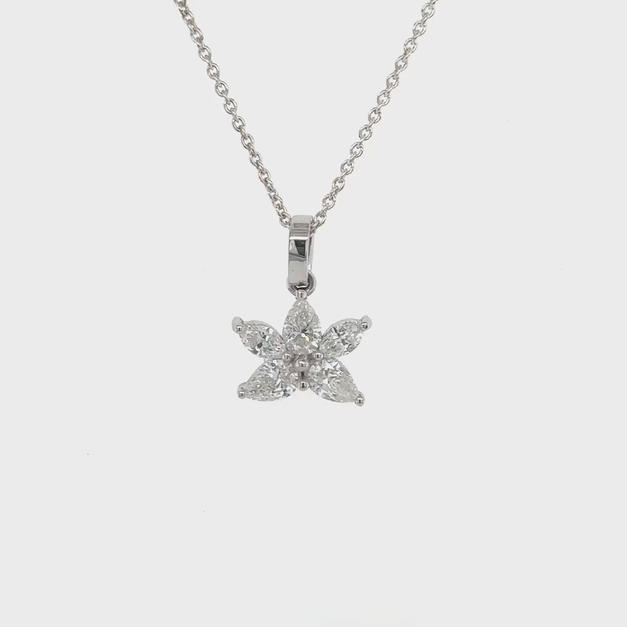 Marquise and pear-shaped illusion diamond pendant, elegant jewelry piece, sparkling gemstones, unique pendant design, luxurious accessory, fine craftsmanship, statement necklace, exquisite diamond pendant, sophisticated jewelry, timeless beauty