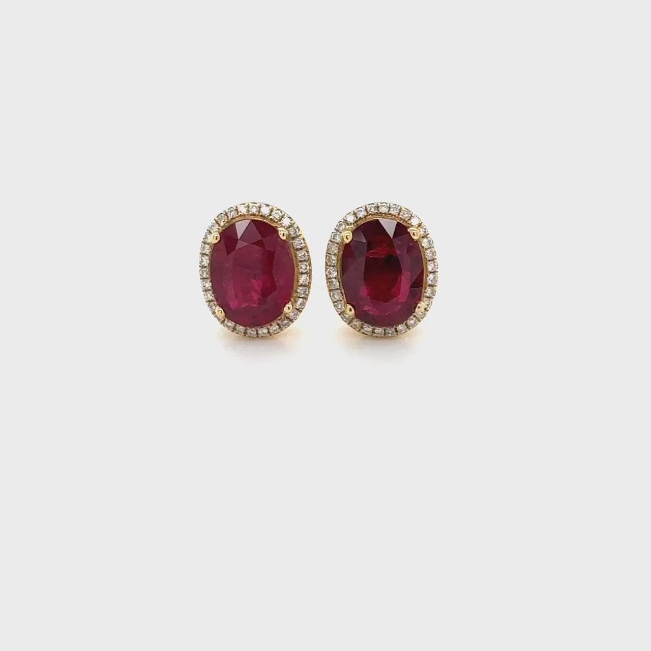 "Oval Ruby & Diamond Halo Stud Earrings": "Oval Ruby Earrings," "Diamond Halo Studs," "Ruby and Diamond Jewelry," "Gemstone Stud Earrings," "Fine Jewelry Accessories," "Luxury Earring Collection," "Red Gemstone Studs," "Sparkling Diamond Accents," "Elegant Gemstone Jewelry," "Statement Earrings."