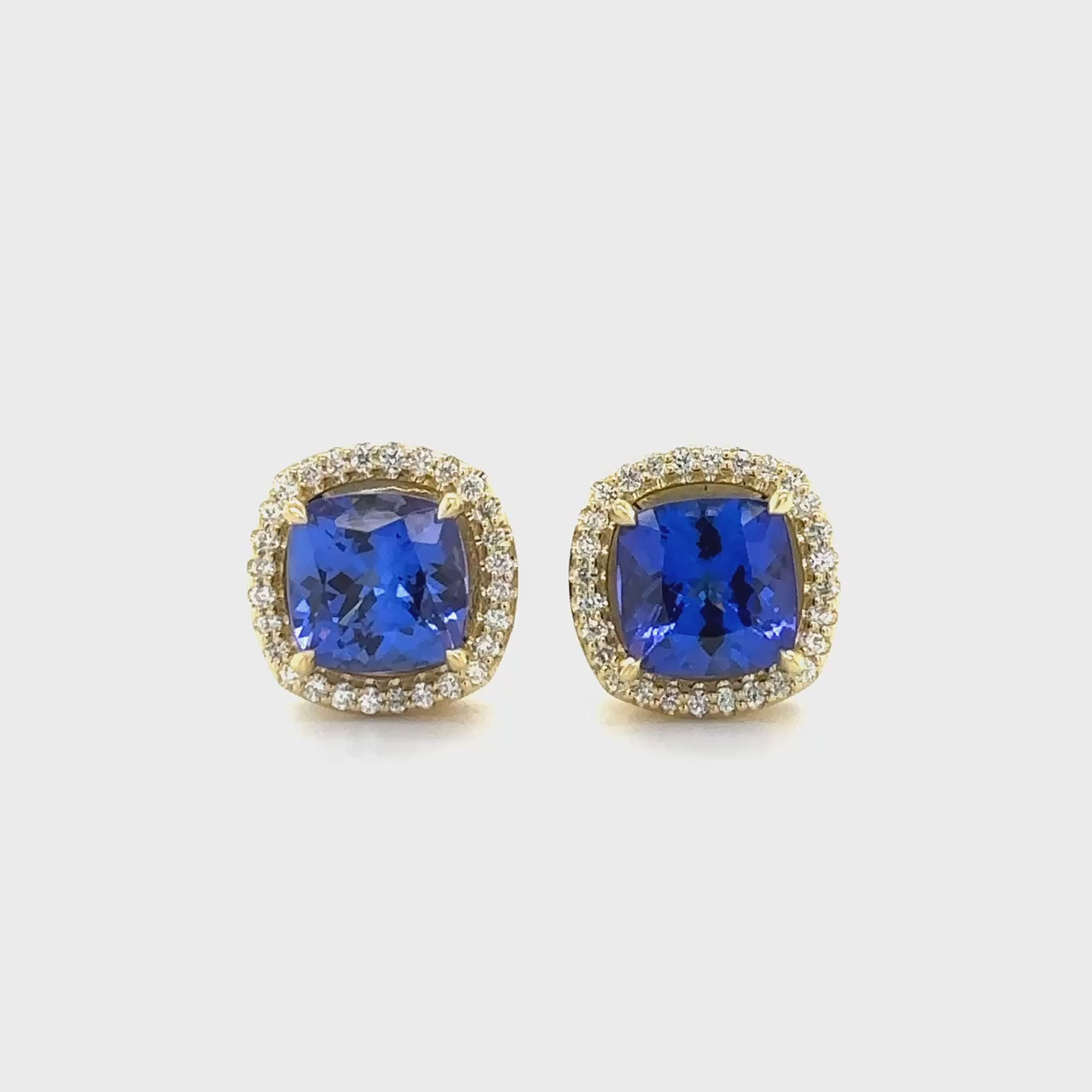 Tanzanite earrings, Diamond halo studs, Gemstone jewelry, Fine jewelry, Halo design, Precious stone earrings, Elegant studs, Blue gemstone earrings, Luxury accessories, Sparkling studs