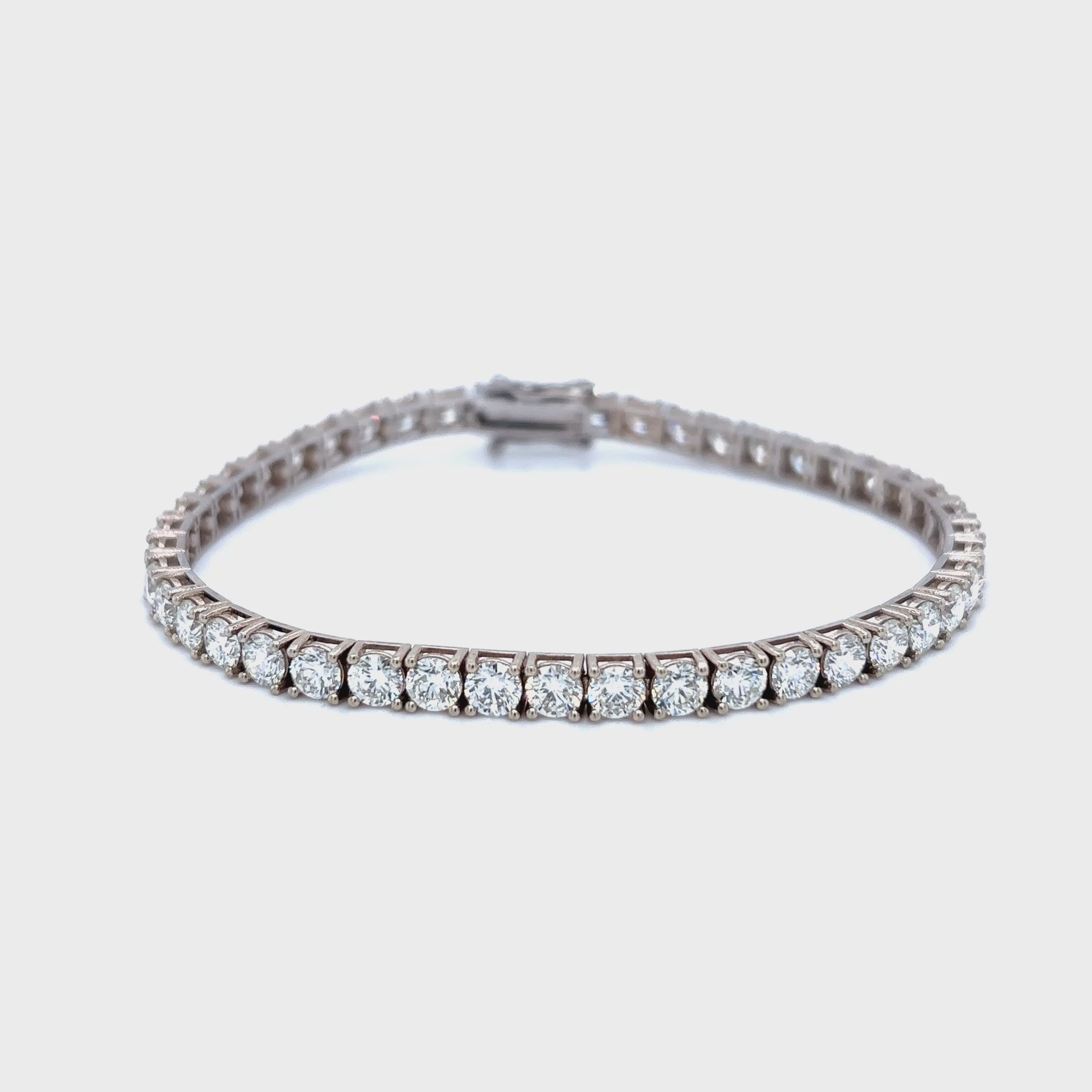Diamond tennis bracelet, classic diamond bracelet, elegant diamond line bracelet, round brilliant cut diamond bracelet, fine jewelry tennis bracelet, luxury diamond bracelet for women, timeless diamond jewelry, designer tennis bracelet, white gold diamond bracelet, everyday diamond bracelet.