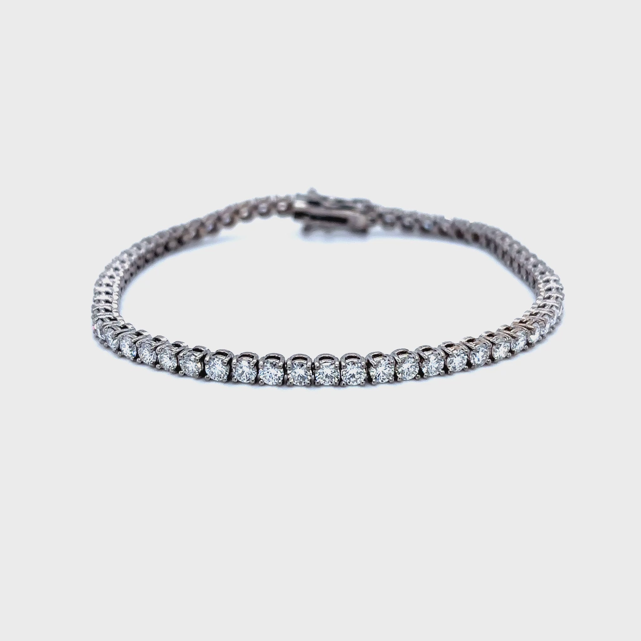 Diamond tennis bracelet, classic diamond bracelet, elegant diamond line bracelet, round brilliant cut diamond bracelet, fine jewelry tennis bracelet, luxury diamond bracelet for women, timeless diamond jewelry, designer tennis bracelet, white gold diamond bracelet, everyday diamond bracelet.