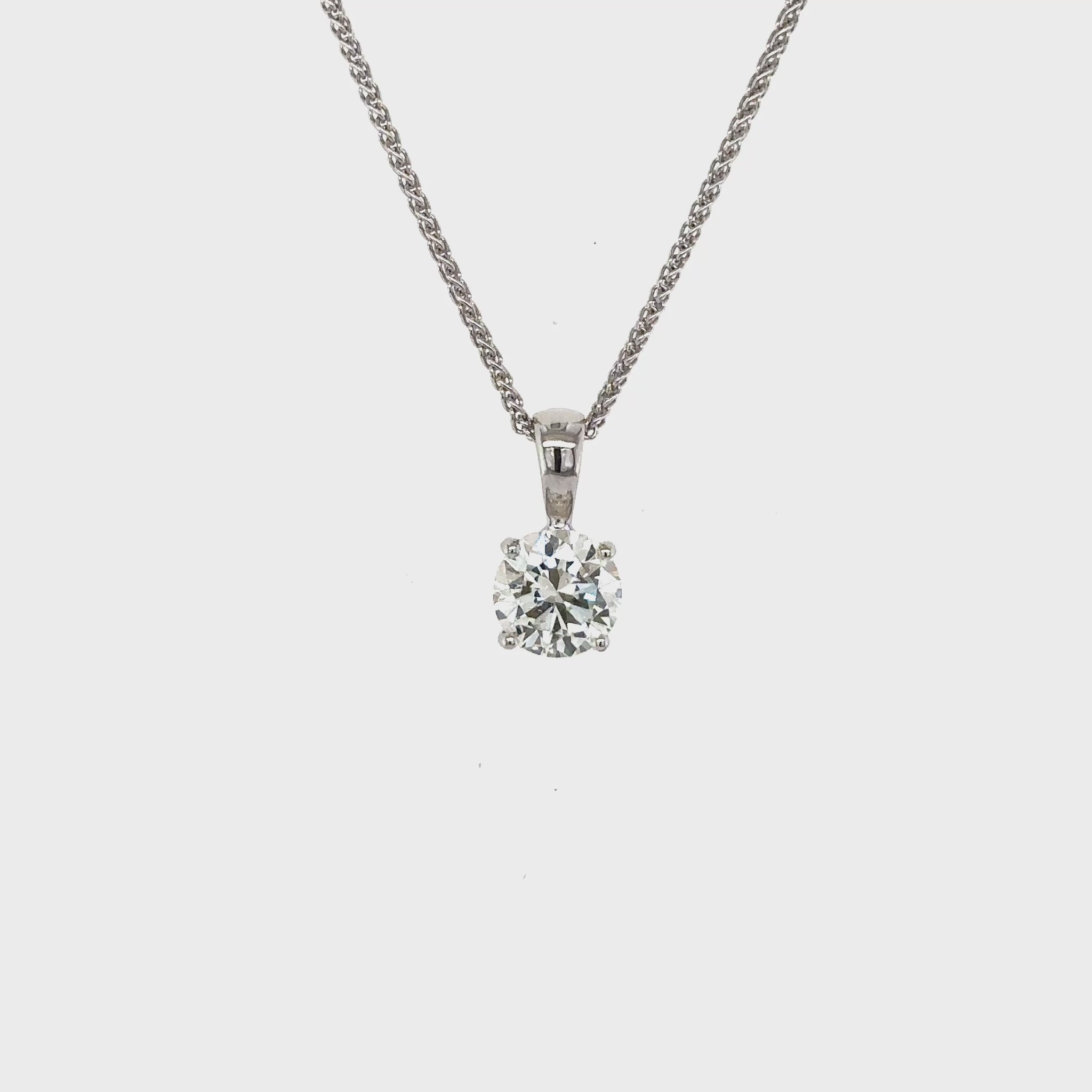 round brilliant diamond pendant, solitaire diamond necklace, classic diamond jewelry, round cut diamond pendant, elegant diamond pendant, fine jewelry necklace, timeless diamond pendant, white gold solitaire pendant, luxury diamond necklace, women’s diamond jewelry