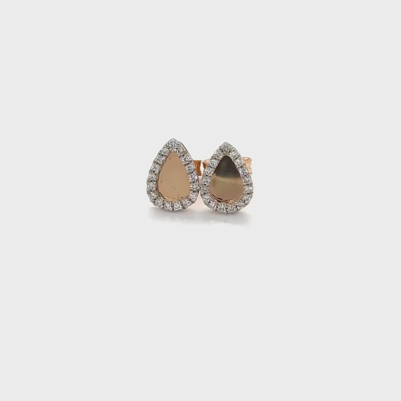 Tear drop halo diamond stud earrings, tear drop earrings, halo earrings, diamond stud earrings, jewelry, accessories, fashion accessories, women's jewelry, elegant earrings, glamorous earrings, luxury earrings.