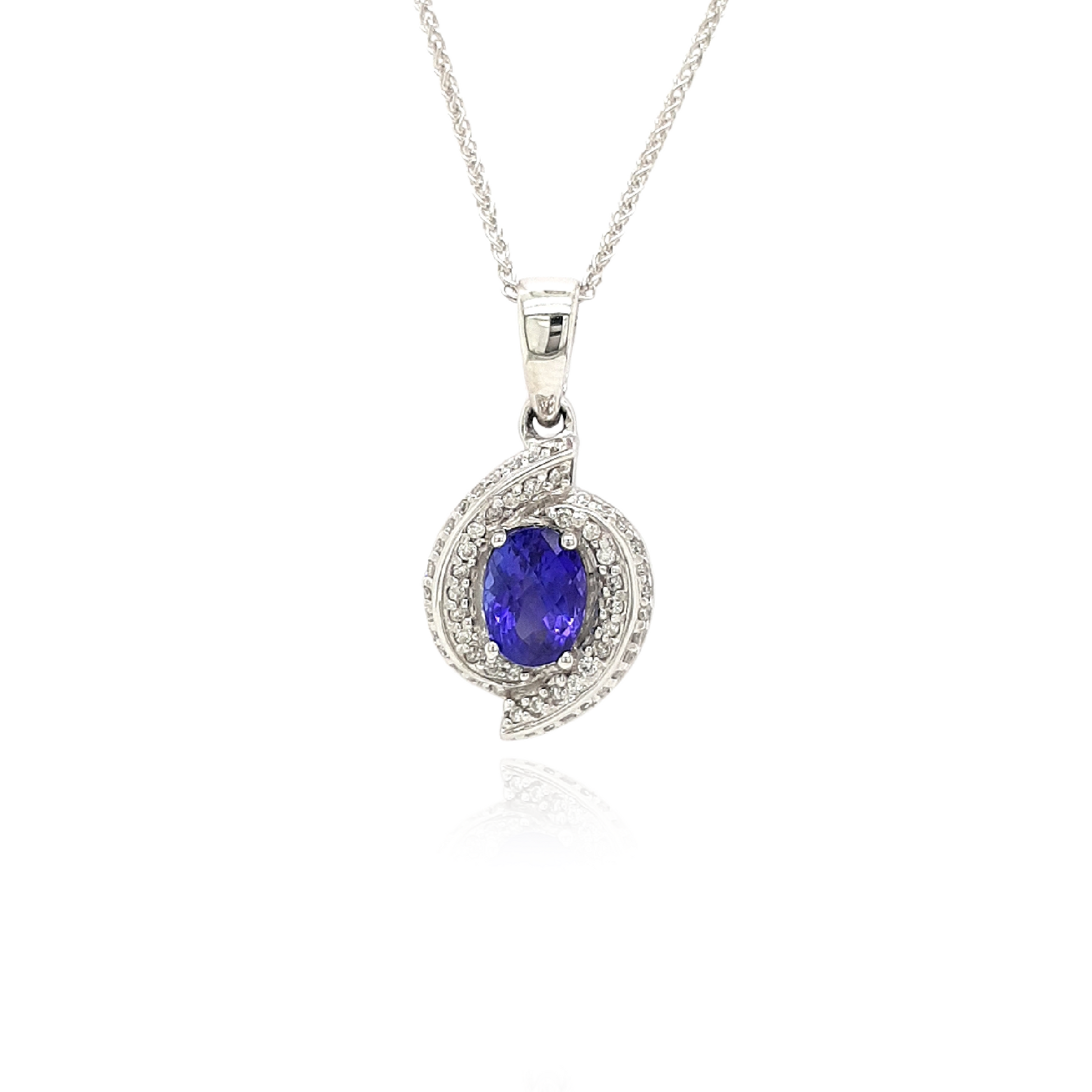 A captivating Oval Tanzanite pendant, intricately designed with a Diamond swirl, elegant Tanzanite and Diamond pendant, stylish swirl pendant with Oval Tanzanite and Diamonds, exquisite jewelry featuring an Oval Tanzanite and Diamond swirl design.